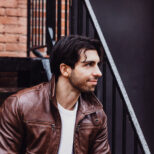 dark-haired-man-in-brown-leather-jacket
